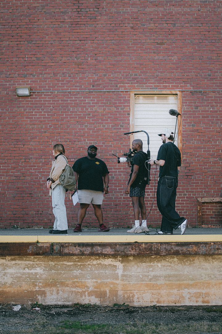 Get Reel WKND crew filming on a brick loading dock